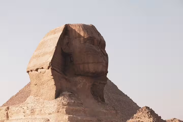 Side view of the Great Sphinx of Giza in Egypt under clear sky, iconic stop on Cairo pyramids day tour