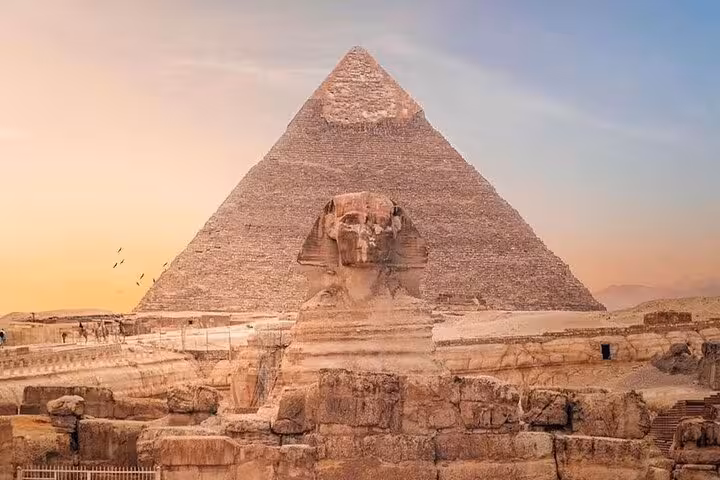 Great Sphinx and Great Pyramid of Giza at sunset on Cairo day tour by bus from Sharm El Sheikh