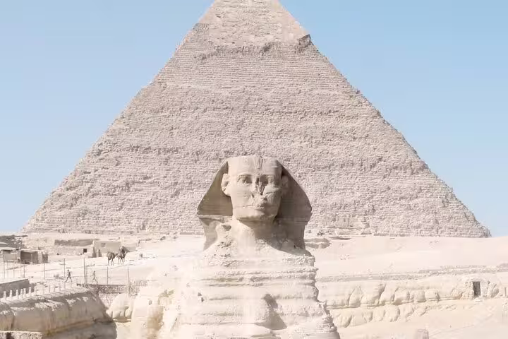 Great Sphinx with the Pyramid of Khafre behind it, highlight stop on Giza Pyramids day tour from Cairo