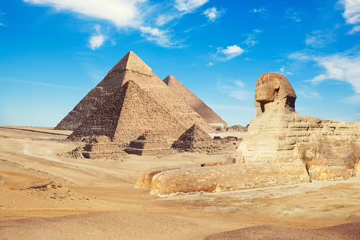 Great Sphinx and Pyramids of Giza under blue sky, highlight of private 3-day Cairo Alexandria tour