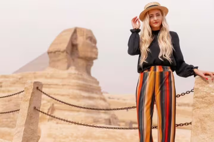 Traveler at the Great Sphinx, Egypt, on private Sakkara Pyramids desert safari tour from El Sokhna Port
