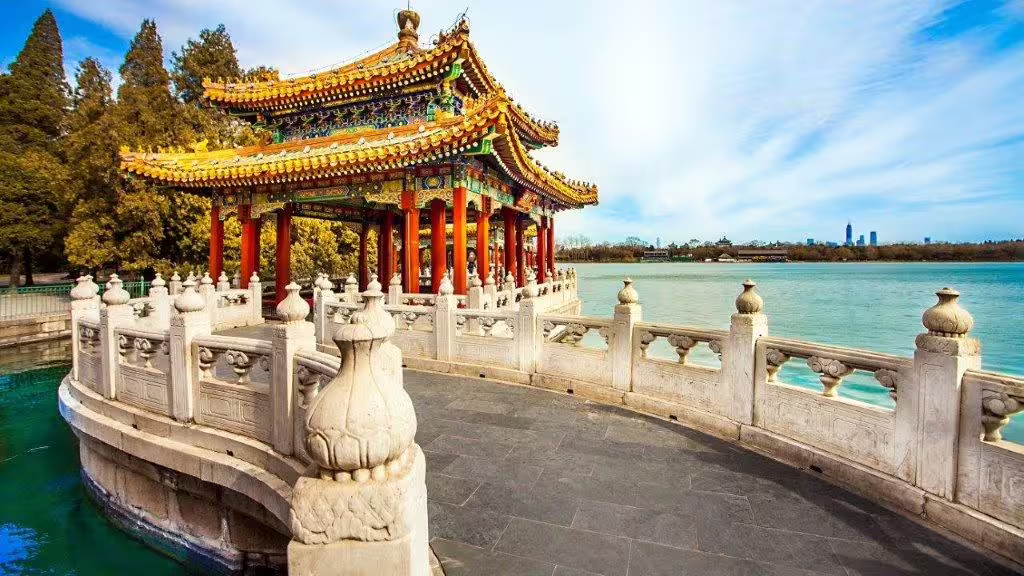 Traditional Chinese pavilion with ornate roof beside a serene lake, ideal for a Great Wall and Warriors private tour.