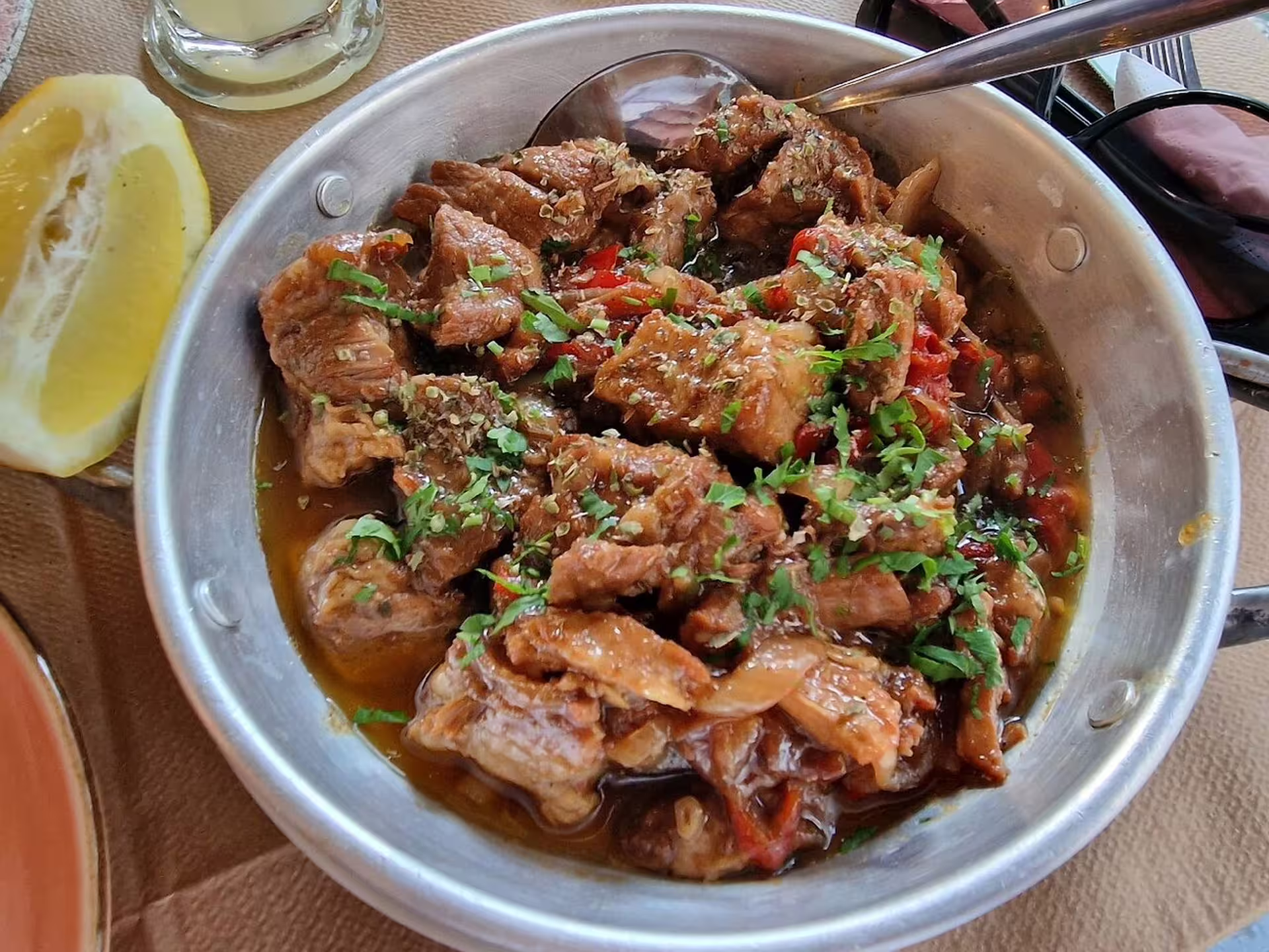 Traditional Greek meat stew with herbs and lemon, a savory tasting on the Athens afternoon food tour