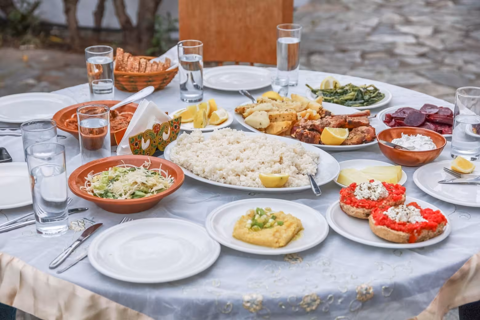 Traditional Greek meze spread with rice, grilled fish and salads, a stop on the Eco Bike food tour tasting