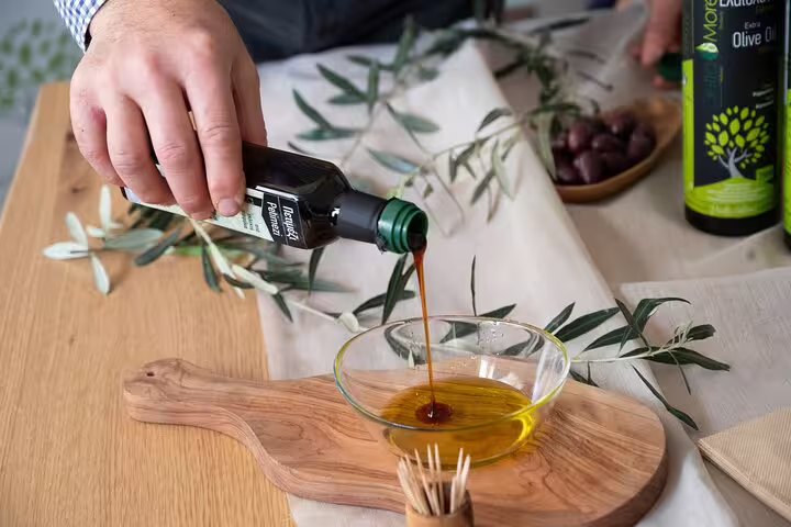 Pouring extra virgin Greek olive oil for tasting, an optional add-on on a private full-day Athens tour