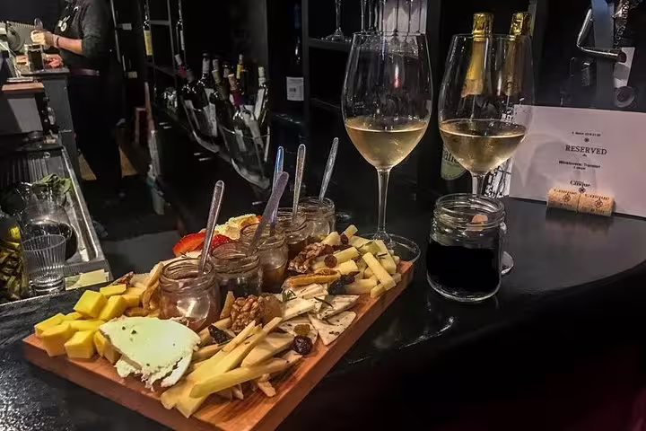 Greek wine and mezze board at Athens night food tasting tour, small group drinks and local bites
