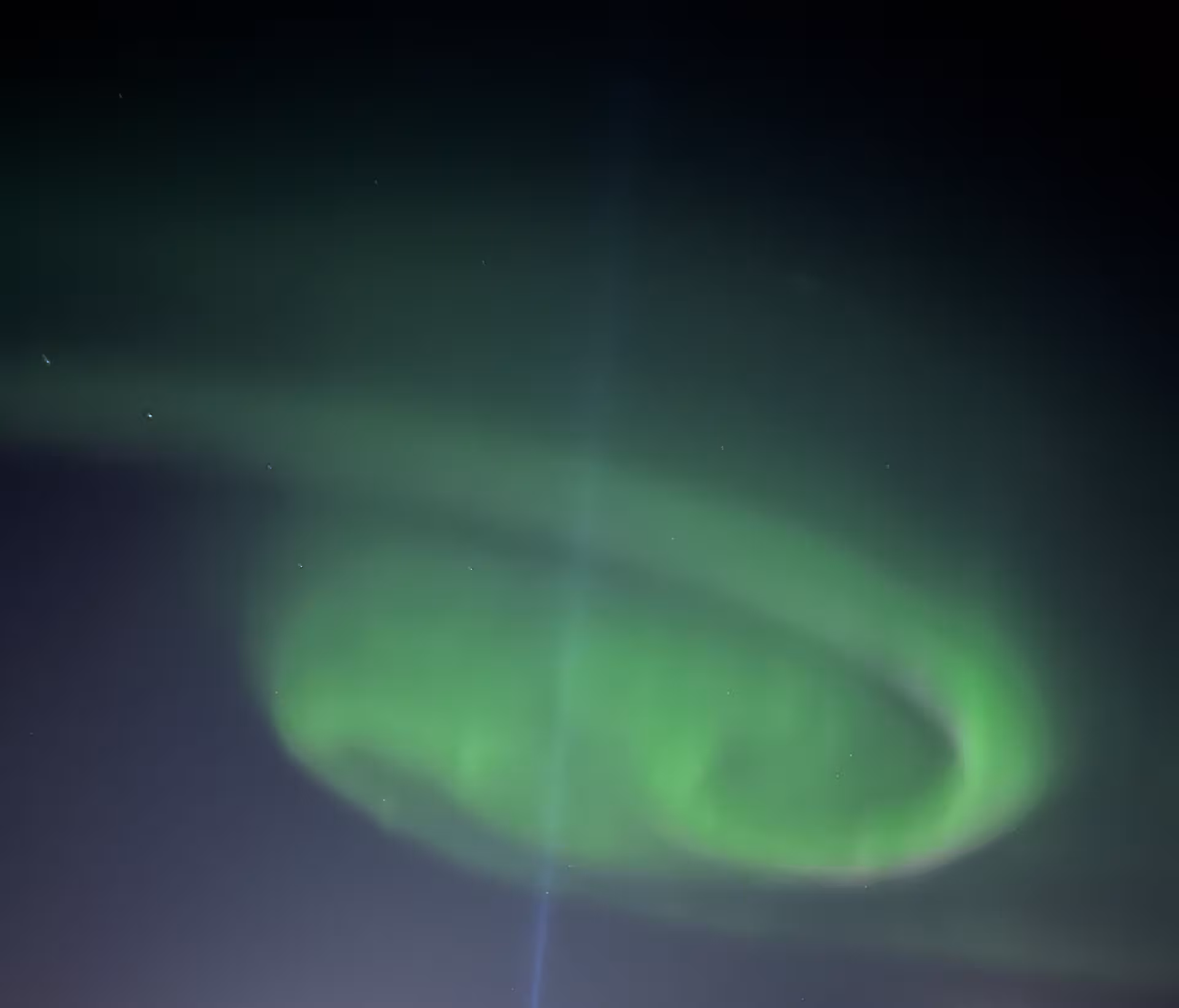 Green aurora borealis swirling overhead on a clear night, ideal for northern lights tour photography
