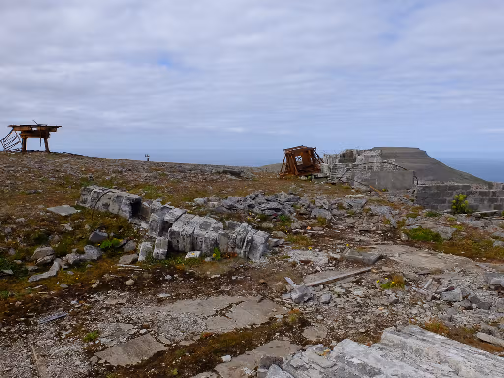 Abandoned ruins on remote Hornstrandir cliffs in Iceland’s Westfjords, with sea views and tundra trail