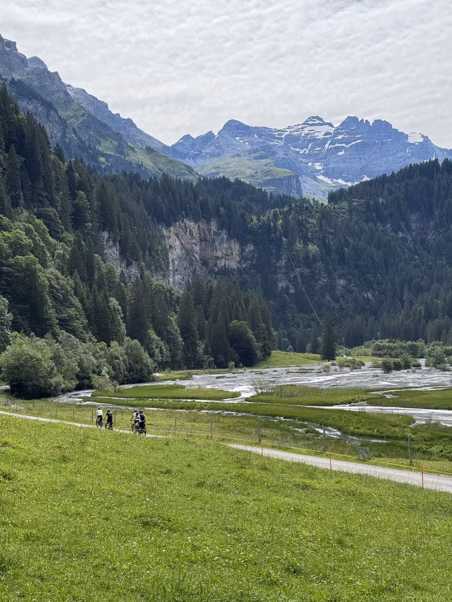E-bike tour along the river plain and forested cliffs in the Griesalp UNESCO alpine valley, Switzerland