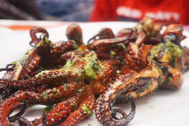 Grilled octopus with herbs served on São Vicente Island tour, offering a taste of local Cape Verdean cuisine.