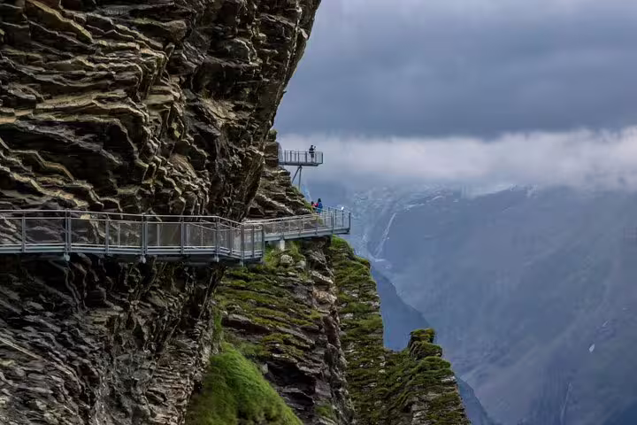 Dramatic cliff walk at Grindelwald First offering breathtaking views on adventure tour from Zurich.