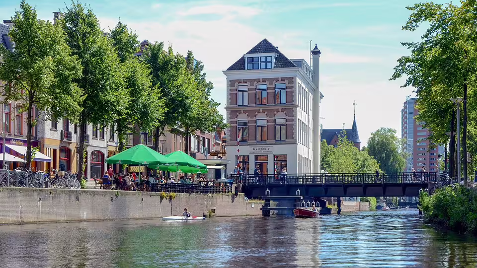 Groningen canal with terrace cafés and bridge, highlight of the 1-day self-guided walking tour audioguide in 7 languages