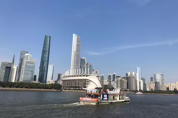 Scenic view of Guangzhou skyline with modern skyscrapers along the Pearl River, ideal for a layover private tour.
