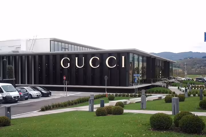 Gucci store facade at The Mall luxury outlet, perfect shopping destination near Rome for fashion enthusiasts.