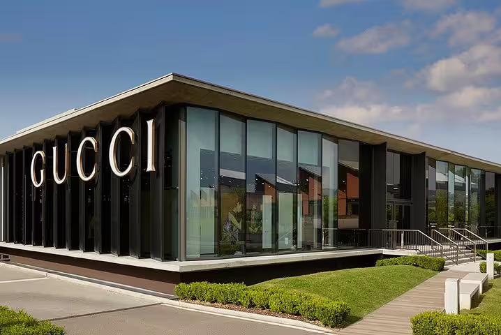 Modern Gucci store facade at The Mall luxury outlets in Tuscany, featured stop on private chauffeur shopping experience