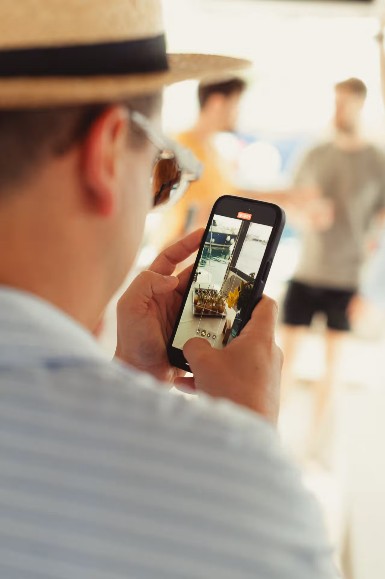 Guest filming a Wine & Art experience on a phone, capturing creative moments during a wine tasting tour