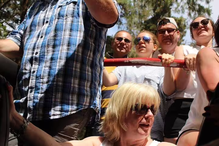 Group enjoying a guided 4x4 adventure tour in Madeira, capturing the thrill of off-road exploration with scenic views.