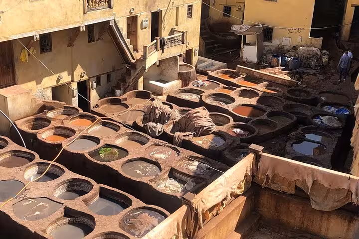 Vibrant tanneries in Old Medina Fez displaying colorful dyeing vats, a highlight of the guided walking tour.