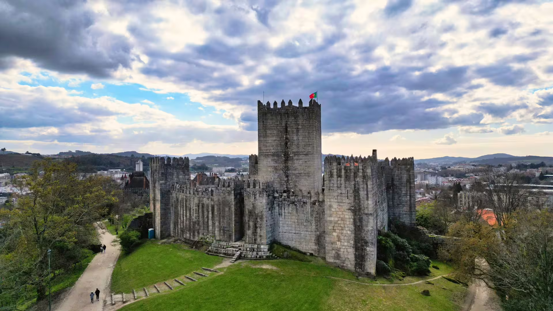 Aerial drone close-up of the Castle of Guimarães, part of Cooltour Oporto's Braga & Guimarães Tour