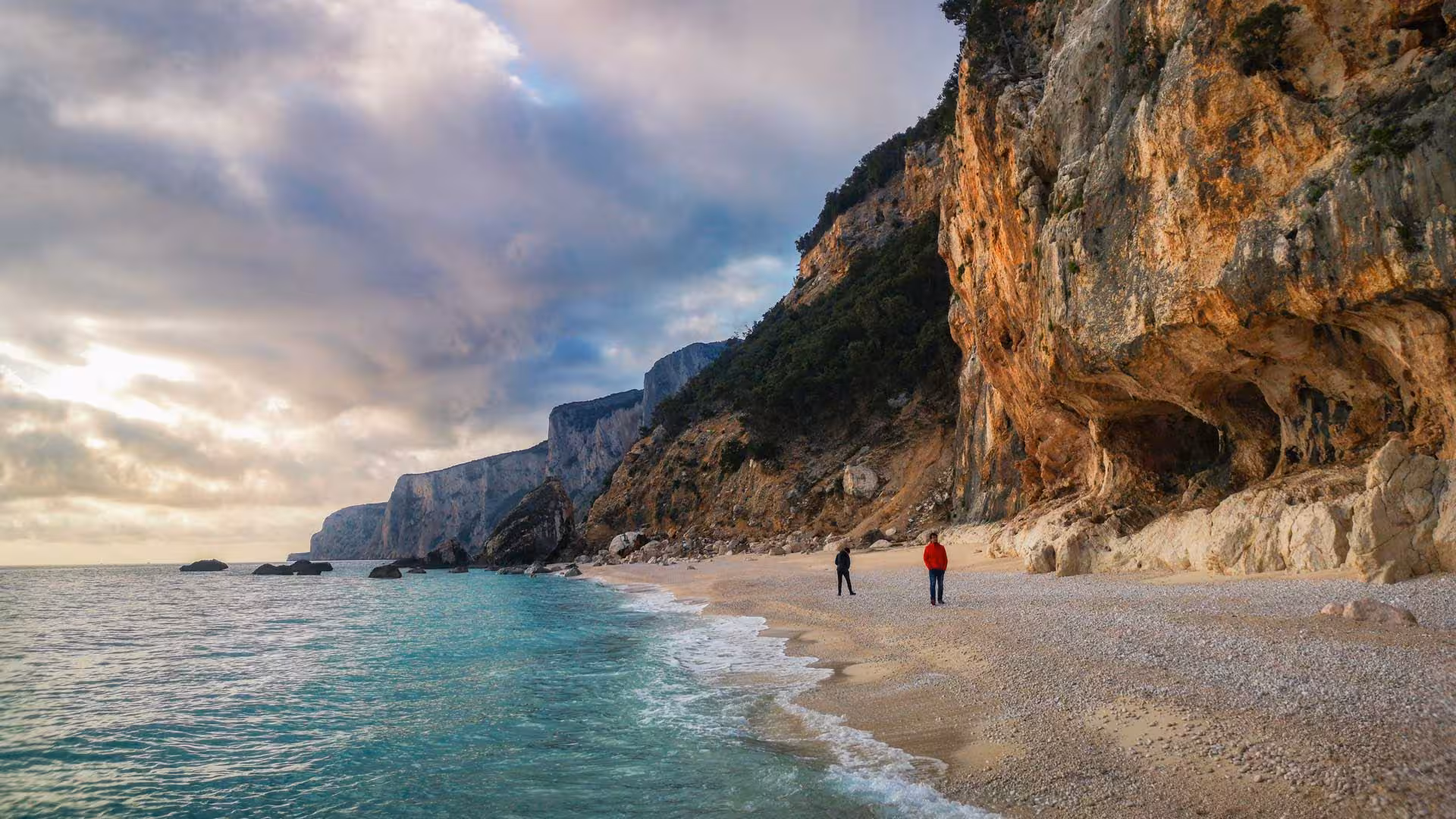 Scenic view of the Gulf of Orosei coastline with clear turquoise water and dramatic cliffs, perfect for a dinghy tour.