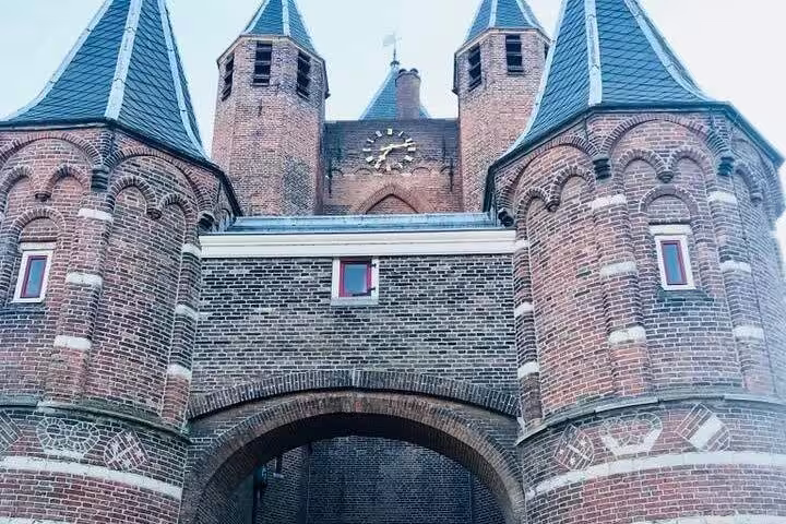 Historic Haarlem city gate and towers on Your Own Holland tour, en route to coastal dunes and the North Sea