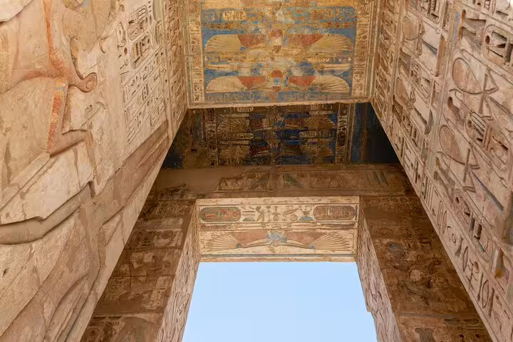 Painted ceiling and hieroglyphs inside Habu Temple gateway, Luxor West Bank Valley of Queens tour