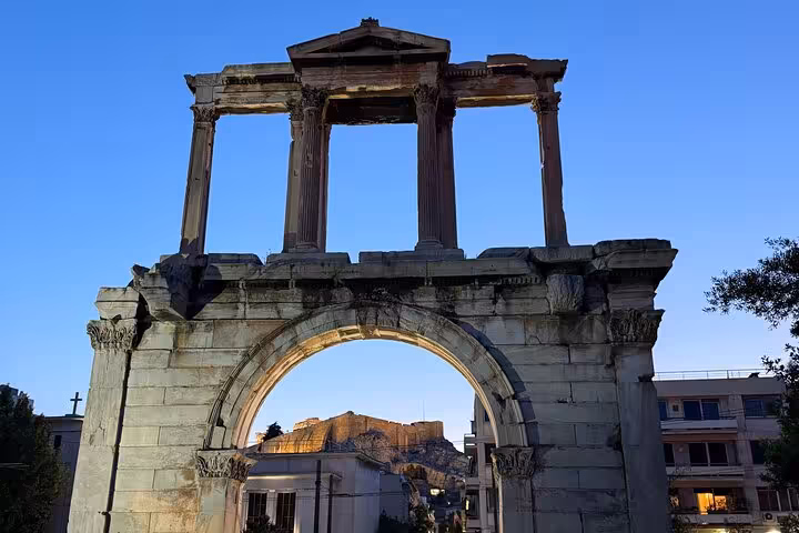 Hadrian's Arch in Athens on an airport transfer with express city highlights, framing the Acropolis view