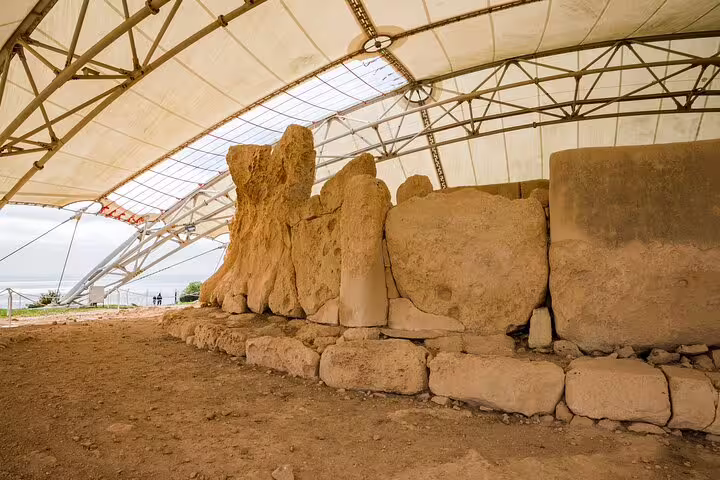 Ħaġar Qim temples megalithic stone ruins under protective canopy, highlight stop on Malta private half-day tour