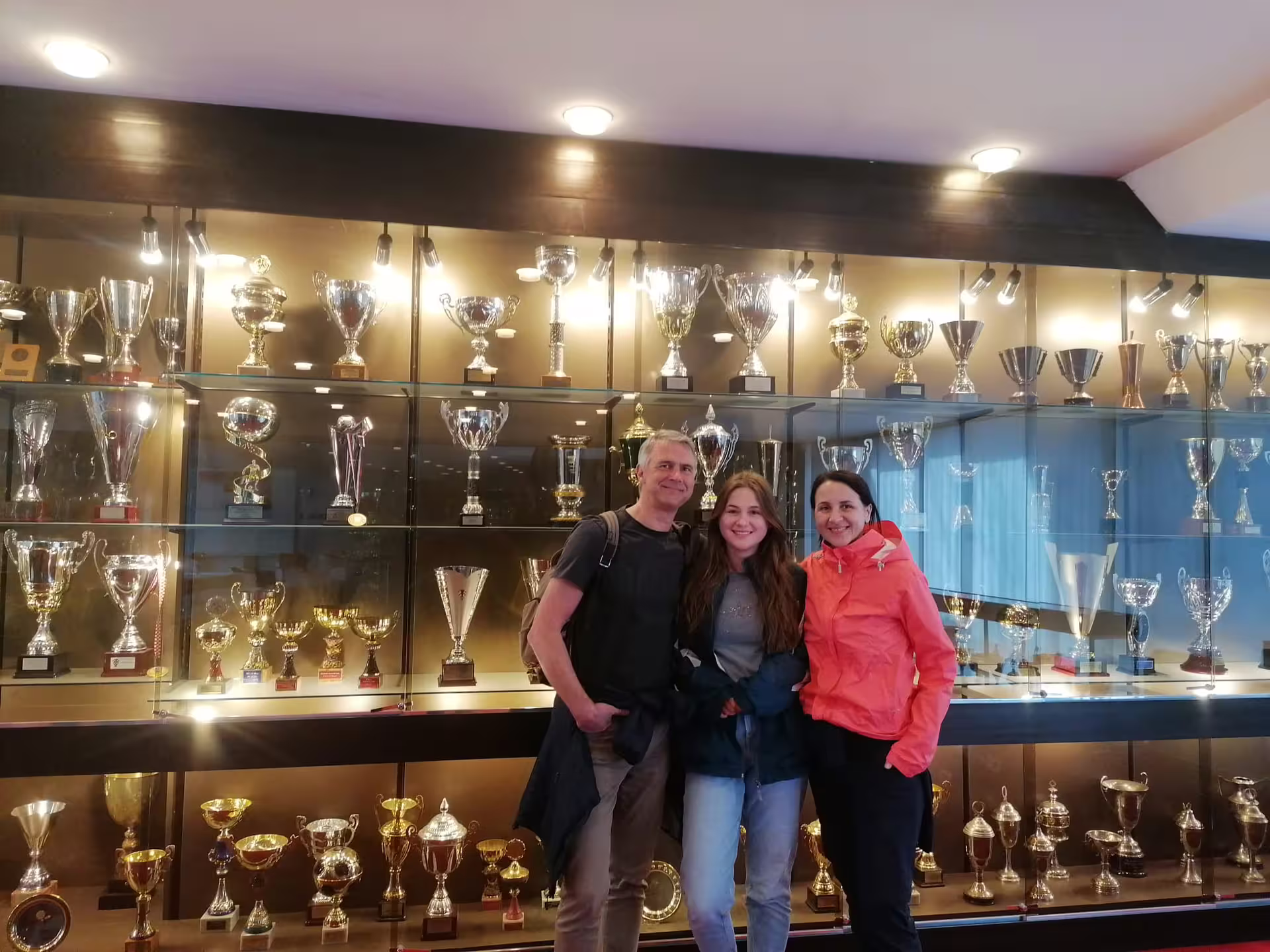 Guests by Hajduk Split trophy display on Poljud Stadium tour, part of Split Bike, Beer experience