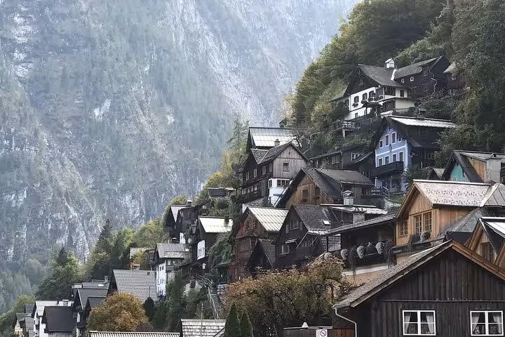 Traditional Hallstatt hillside houses and wooden chalets above Lake Hallstatt on a small-group tour from Vienna