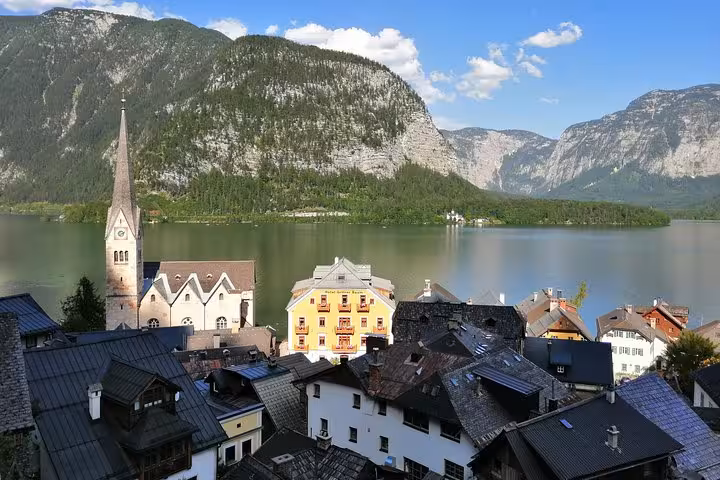 Hallstatt village rooftops and church spire by Lake Hallstatt on private day tour from Vienna