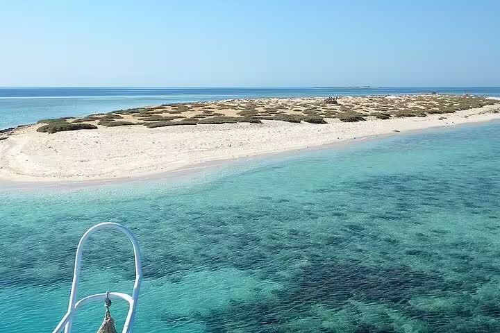 View from VIP boat to Hamata Island sandbar and clear Red Sea reef, Marsa Alam snorkeling tour
