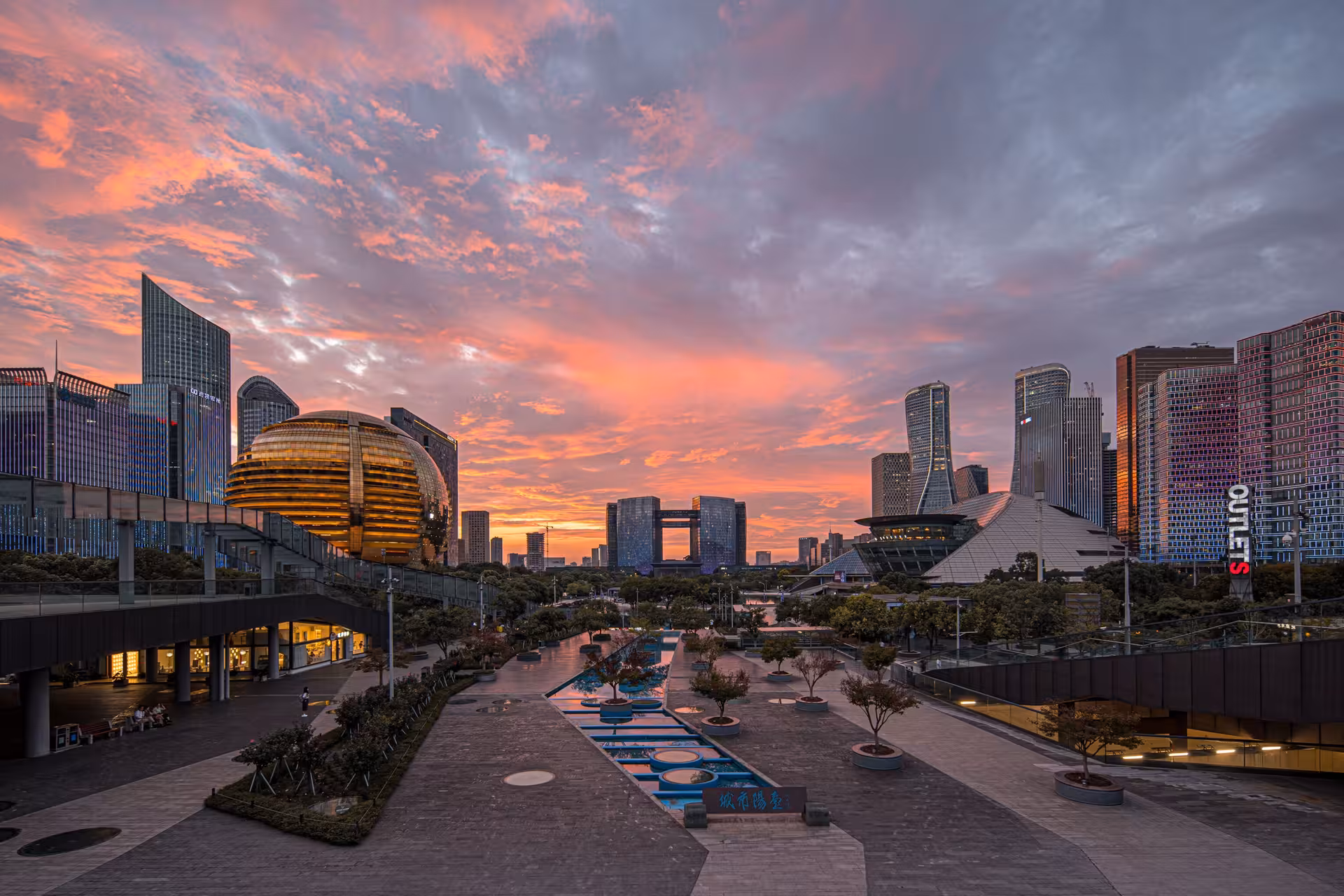 Hangzhou skyline at sunset showcasing modern architecture and vibrant cityscape for private tour experience.