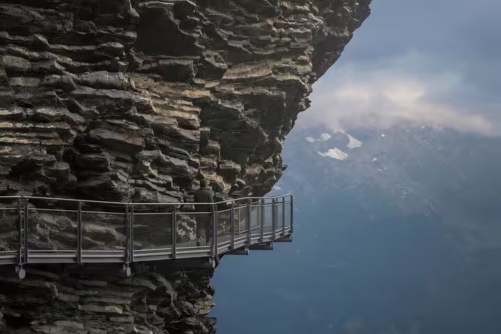 Scenic cliffside walkway with panoramic views on Harder Kulm day trip, perfect for adventure seekers in Grindelwald.