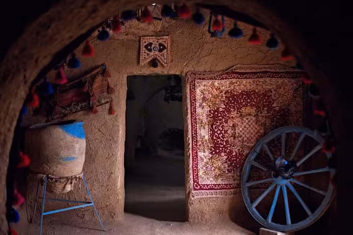 Traditional Harran beehive house interior near Sanliurfa with rug decor, featured on a private guided tour