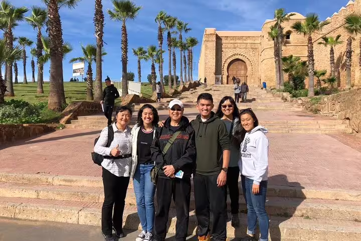 Group photo at the Hassan Tower and Mausoleum in Rabat on a Morocco 12-day tour from Casablanca itinerary