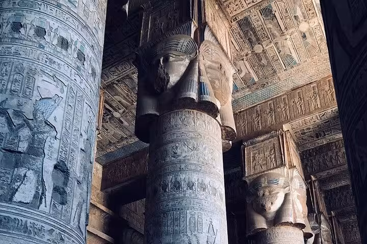 Intricately carved Hathor columns inside Dendera Temple, showcasing ancient Egyptian art on a private half-day tour.