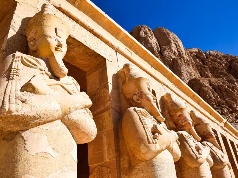 Hatshepsut Temple statues at Deir el-Bahari in Luxor, iconic ancient Egypt site on Highlights tour