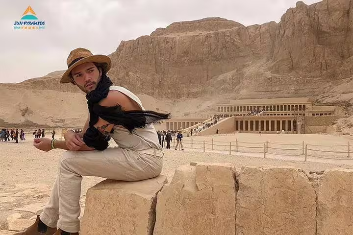 Traveler posing at Hatshepsut Temple, West Bank Luxor, on a 3-day Luxor city break tour package