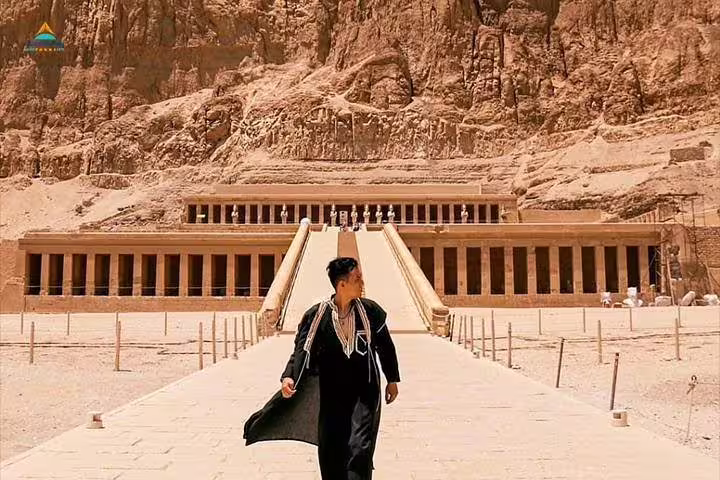 Visitor at Hatshepsut Temple, West Bank Luxor, on private tour from Cairo by flight with Egyptologist