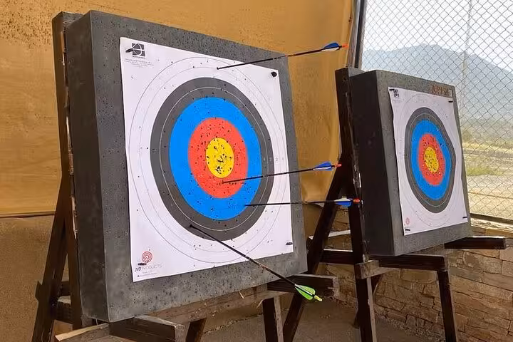 Archery targets with arrows at Hatta outdoor activity stop on private full-day Hatta tour from Dubai