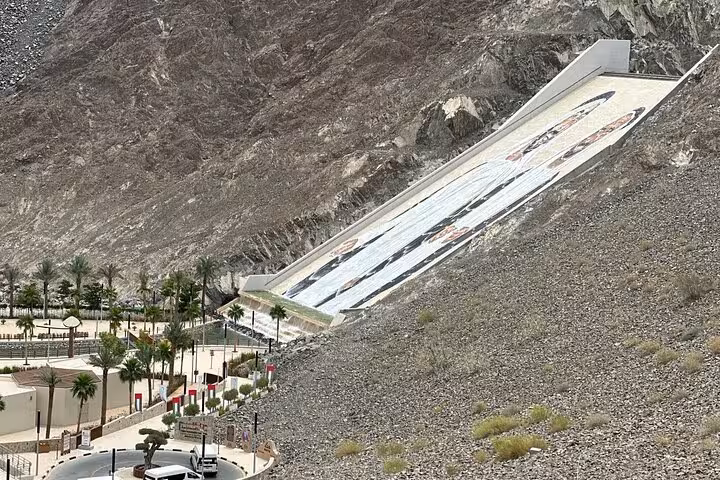 Hatta Dam mountain mural viewpoint on private full-day Hatta tour with scenic heritage village stop from Dubai