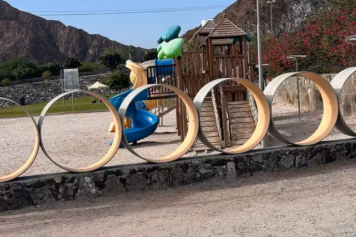 Playground near Hatta Dam with mountain views, stop on private full-day Hatta tour from Dubai