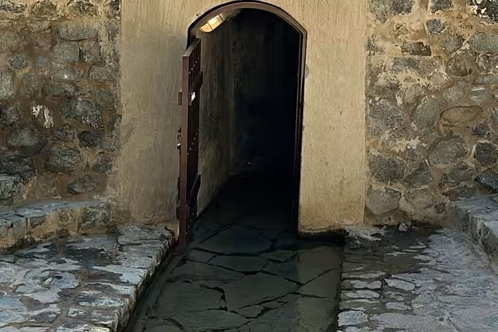 Stone arch doorway inside Hatta Heritage Village on a private full-day Hatta tour from Dubai, UAE