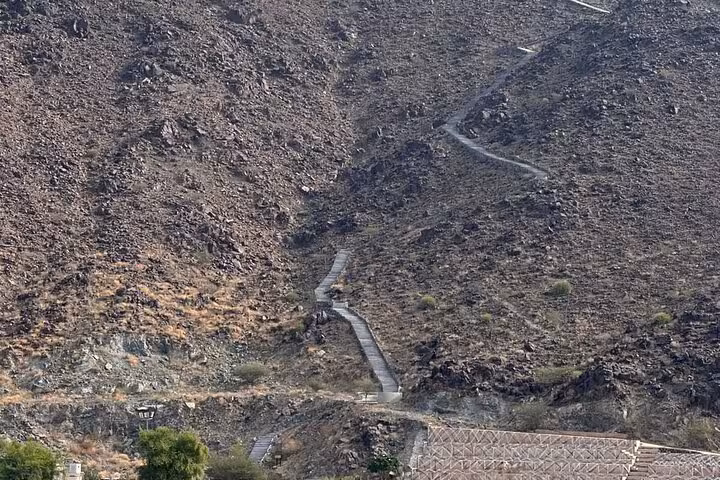 Winding mountain road through rocky Hatta hills, scenic drive highlight on a private full-day Hatta visit tour