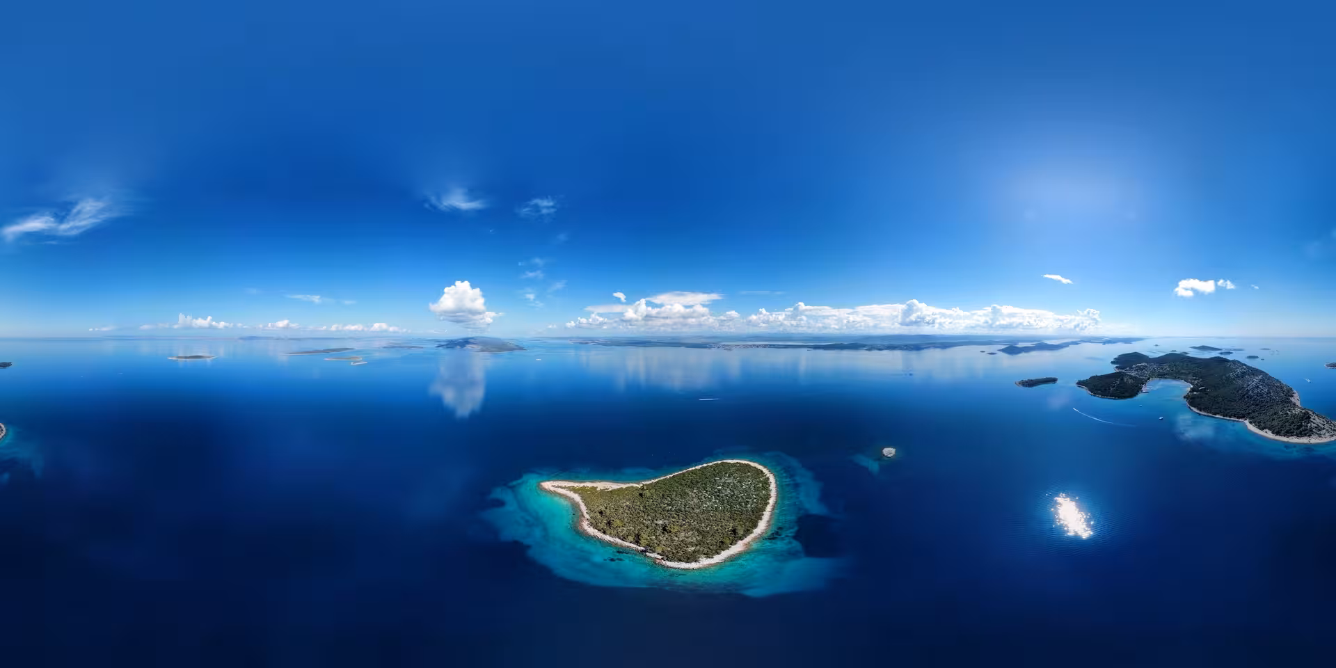 Heart-shaped island in crystal-clear Adriatic Sea, aerial view for Archipelago Adventure island-hopping tour