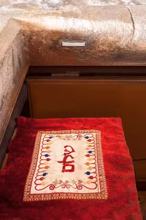 Red Hebrew sign at doorway in Barcelona’s Jewish Quarter, Gothic Quarter and El Born Old Town introduction tour