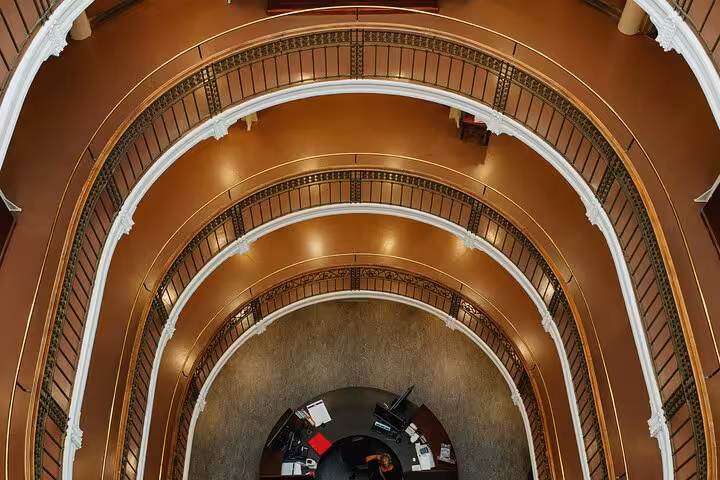 Stunning aerial view of Helsinki's historic library interior, showcasing its elegant circular design and iconic architecture.