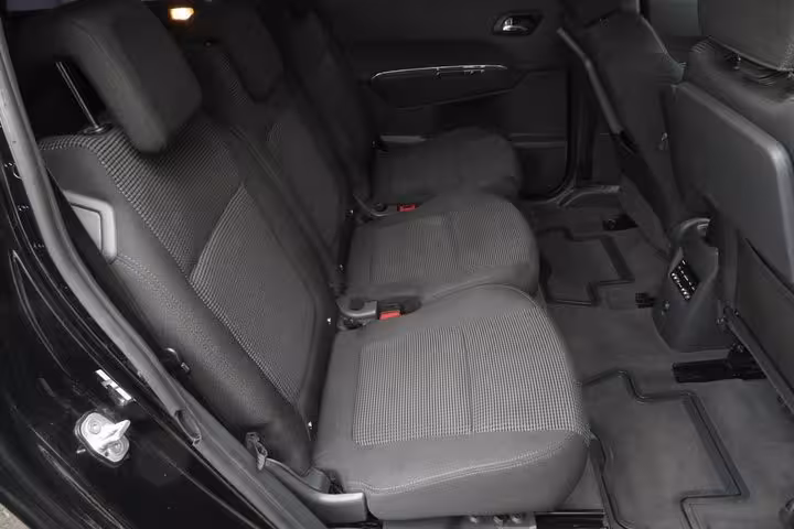 Spacious rear seats inside minivan for Heraklion to Rethymno hotels transfer, ideal for families and groups