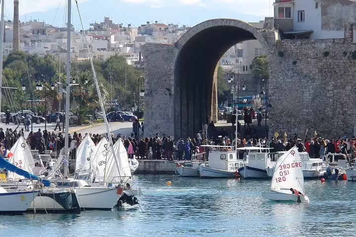 Heraklion’s historic Venetian harbor bustling with boats and tourists, a gateway to Knossos Palace and the Archaeological Museum.